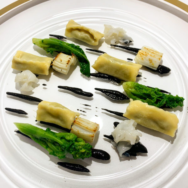Agnolotti del plin all'assoluto di cime di ripa, seppie, friarelli al naturale e salsa forte al fegato di seppia